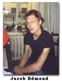 a color photograph of Edmond wearing glasses