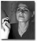 image of Sikelianos in black and white. She is holding a cigarette in her right hand.