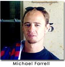 Michael Farrell looks at the camera. He has sunglasses on his head