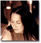 A sepia image of Dale Going. She is looking down toward the right of the image.