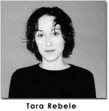 a black and white photo of Rebele looking at the camera in a dark shirt