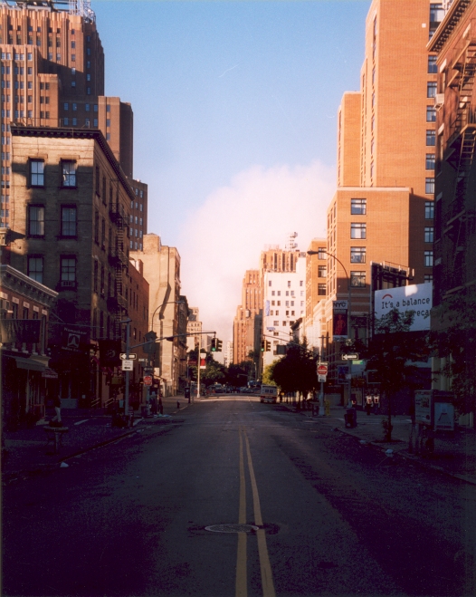 Looking south on a New York street, the horizon absent of the Twin Towers