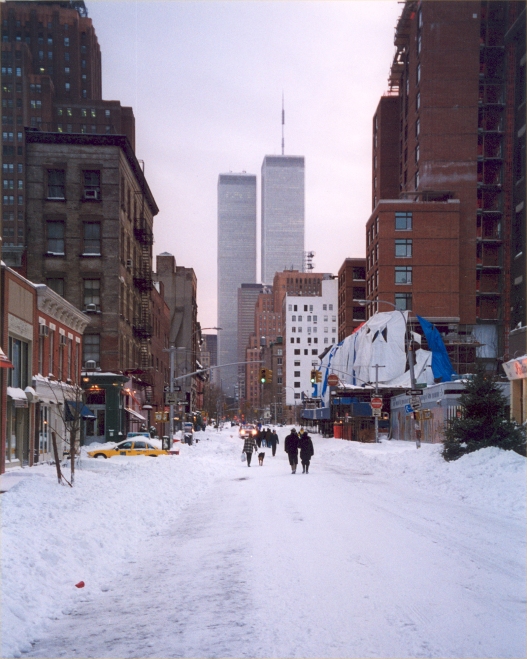 A snowy street in New York looking south at the Twin Towers