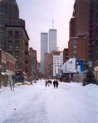 A snowy street in New York looking south at the Twin Towers